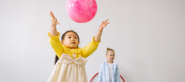 child throwing ball