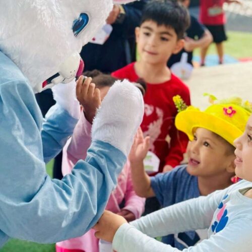 easter bunny interacting with children