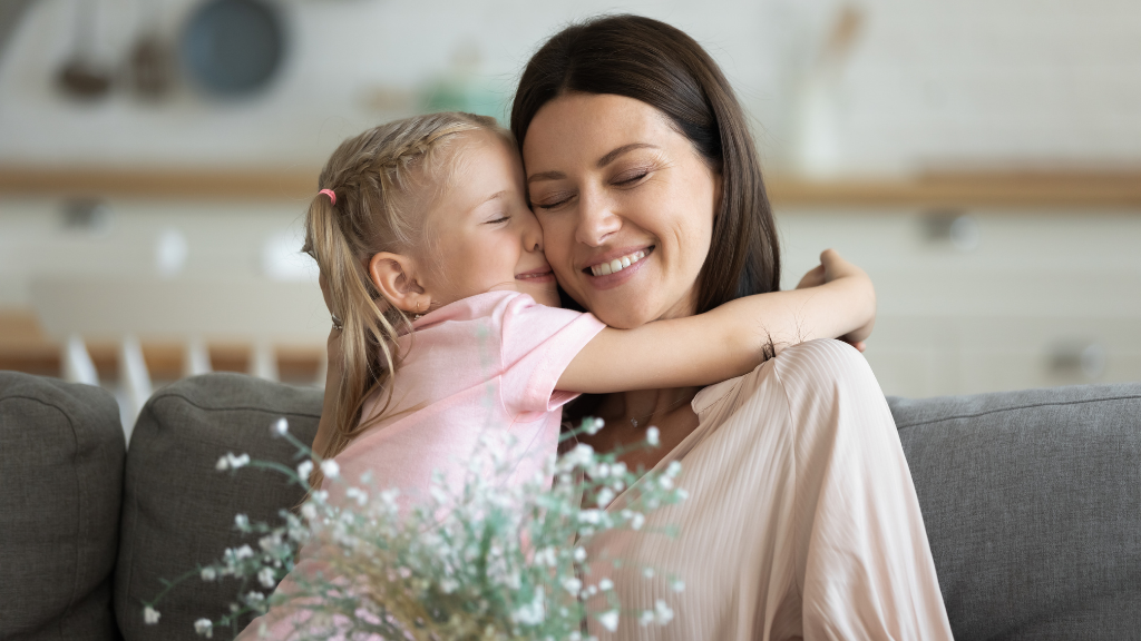 raising happy kids3 girl hugging mum