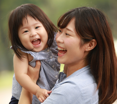 happy child and parent hugging