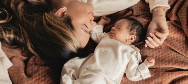 mum laying with baby background