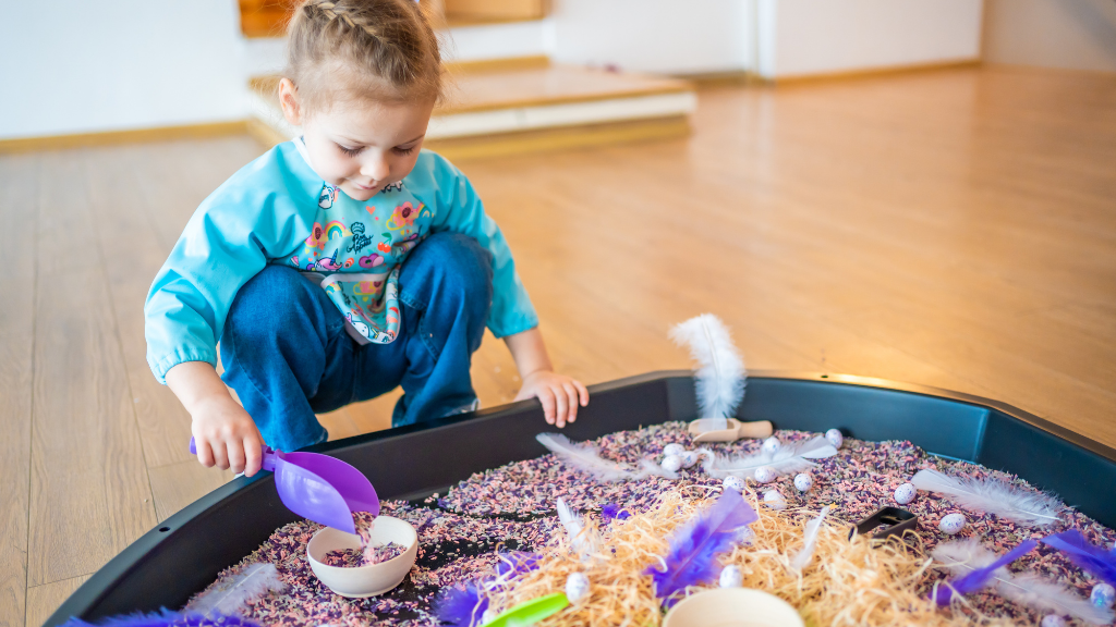 sensory play child playing with sensory tray