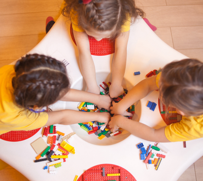 children playing with lego together