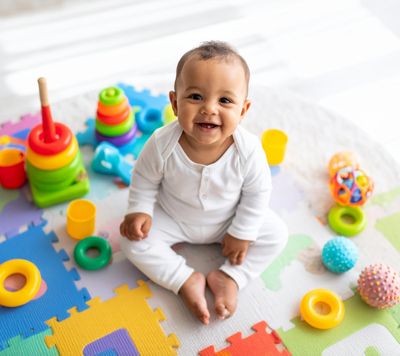 child happy with toys in childcare