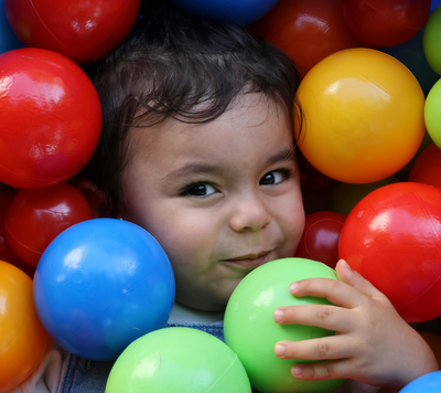 Hockey child smiling with colourful balls