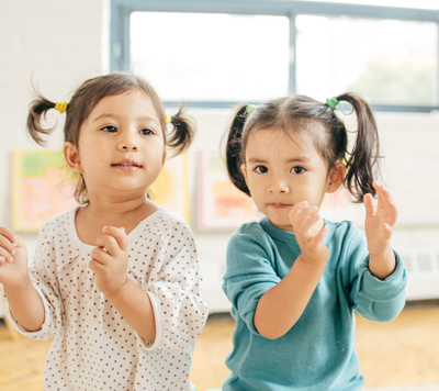 girls clapping and dancing at childcare