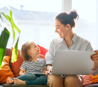 child sitting with mum on couch