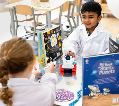 two children in lab coats