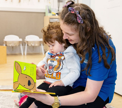 Educator and child reading