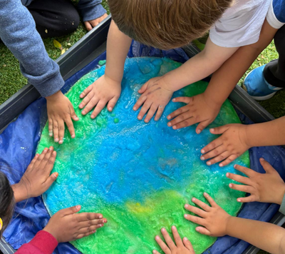 children creating earth artwork