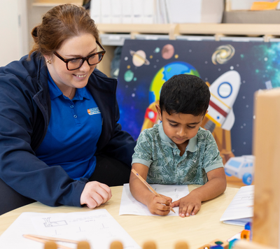 educator and child doing maths educator and child doing maths