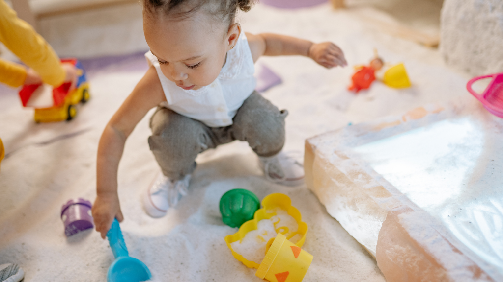 child playing in sandpit