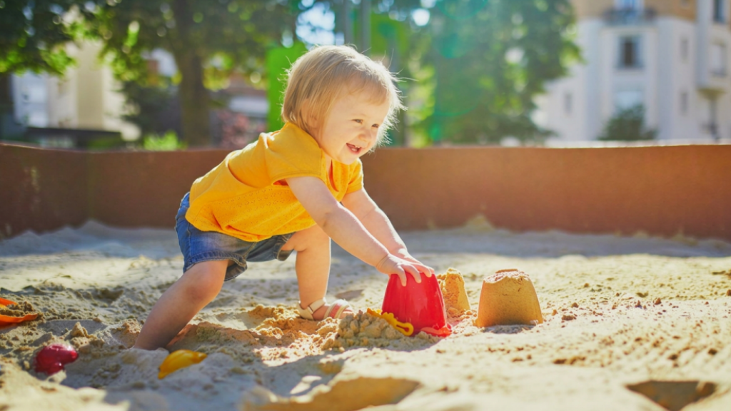 child playing in sandpit
