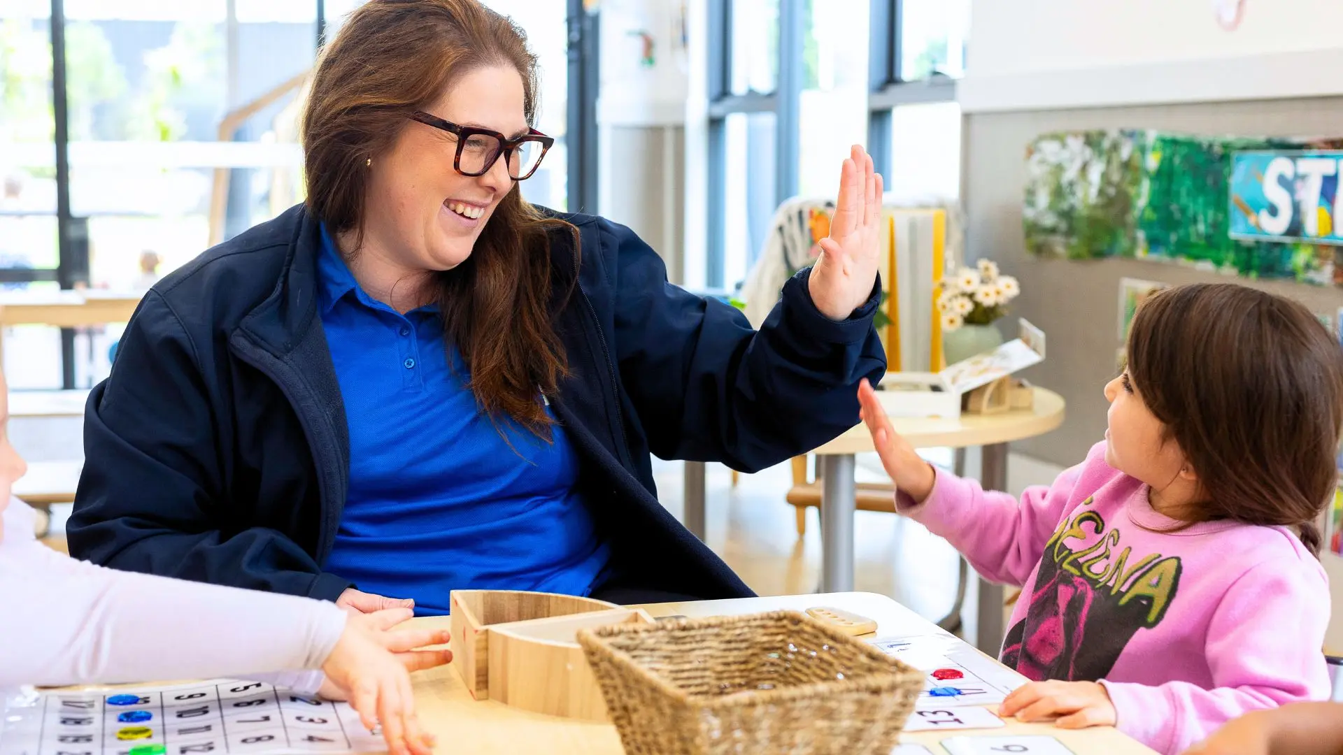 child safety Educator and child high five